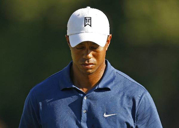 U.S. golfer Tiger Woods reacts during second round play of the Quail Hollow Championship PGA golf tournament at Quail Hollow Golf Club in Charlotte, North Carolina, April 30, 2010. (Xinhua/Reuters Photo)