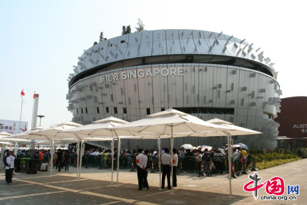 The music-box-like Singapore Pavilion is a two-story structure with an Urban Symphony theme_