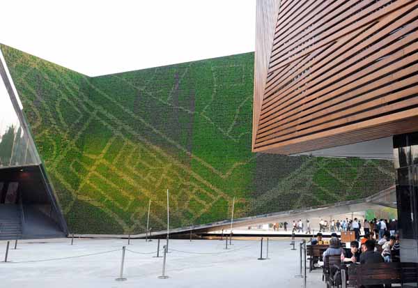 The facade of the Canada Pavilion is decorated with special green-house plants to realize cooling, dust absorption and humidification keeping in the World Expo in Shanghai, east China, on May 1, 2010.