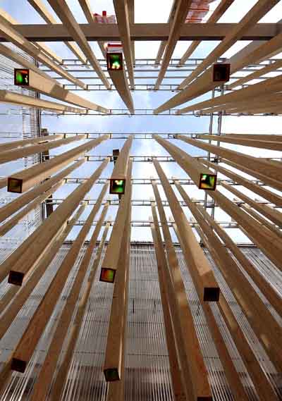 The Hungary Pavilion is decorated with more than 800 wood rods, not only reflecting light, but also rising and falling with changing music rhythms to bring visitors both audio and visual impacts in an artificial &apos;forest,&apos; in the World Expo in Shanghai, east China, on May 1, 2010.