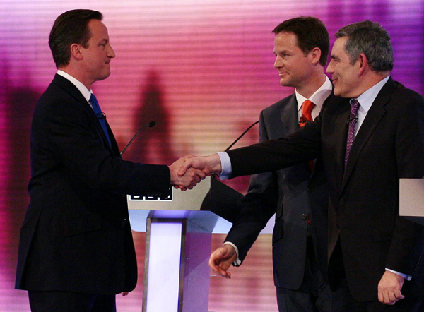 Britain's opposition Conservative Party leader David Cameron (L), Liberal Democrat leader Nick Clegg and Prime Minister Gordon Brown (R) greet each other after the third and final televised party leaders' election campaign debate in Birmingham April 29, 2010. [Xinhua/AFP]