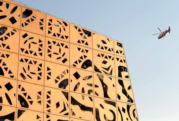 The facade of the Poland Pavilion is decorated with flowery cut-outs wooden materials designed to reflect Polish folk art (paper cut-outs) and able to be repeatably assembled, in the World Expo in Shanghai, east China, on May 1, 2010.