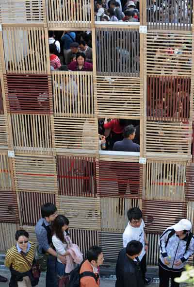 The Peru Pavilion is decorated with bamboo rods, which allow sunshine to pass through the gaps, in the World Expo in Shanghai, east China, on May 1, 2010.