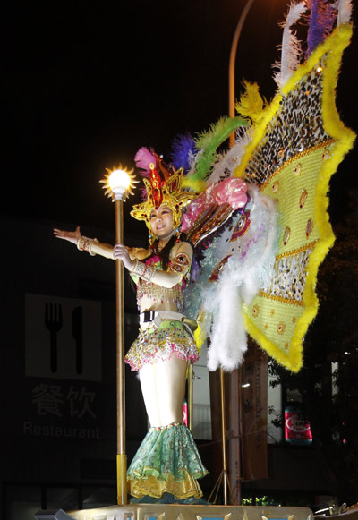A performer is seen on a float during Expo 2010 Shanghai China Parade in the World Expo in Shanghai, east China, on May 2, 2010. 