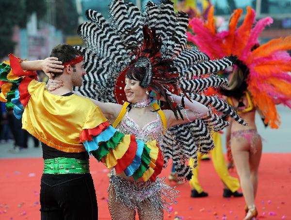 Brazilian performers dance during a carnival parade marking the opening of the 2010 Kunming Tourism Festival in Kunming, capital of southwest China's Yunnan Province, May 1, 2010, [Xinhua/Lin Yiguang]