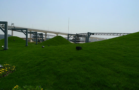 The scenes of the Pavilion roof on May 3, 2010. The planted meadow and flower-beds bring visitors to the 'Nature's Playground'. [China.org.cn / Xu Lin]