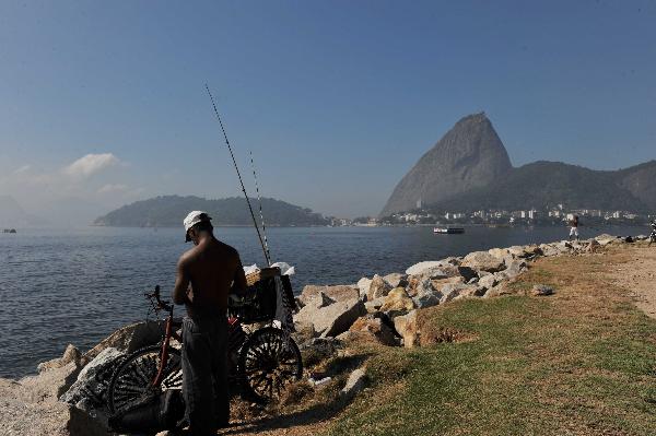 A man fishes at the beach of Flamengo in Rio de Janeiro, Brazil, May 2, 2010.