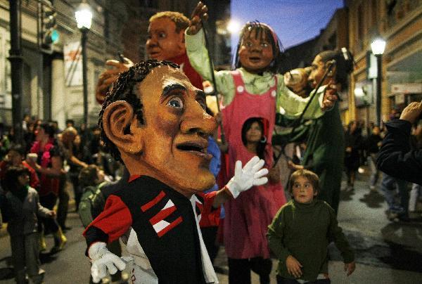 Members of different Chilean groups perform during a clown festival in Valparaiso city, about 120 km (75 miles) northwest of Santiago, May 3, 2010. The city is celebrating the year of Chile's bicentenary with art activities in public places in a lead-up to the country's 200th anniversary of independence on September 18, 2010. 