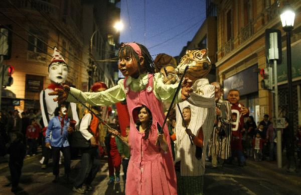 Members of different Chilean groups perform during a clown festival in Valparaiso city, about 120 km (75 miles) northwest of Santiago, May 3, 2010. The city is celebrating the year of Chile's bicentenary with art activities in public places in a lead-up to the country's 200th anniversary of independence on September 18, 2010.