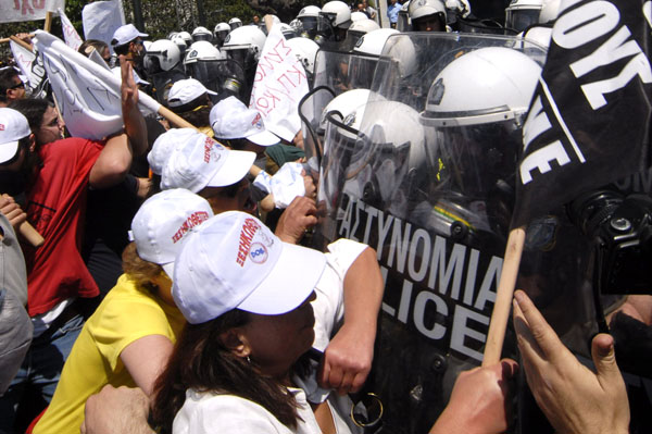 Greeks take part in a protest against the country&apos;s austerity measures in exchange for a massive bailout package from the European Union and the International Monetary Fund, in downtown Athens, capital of Greece, May 4, 2010. [Alexandros Stamatiou/Xinhua]