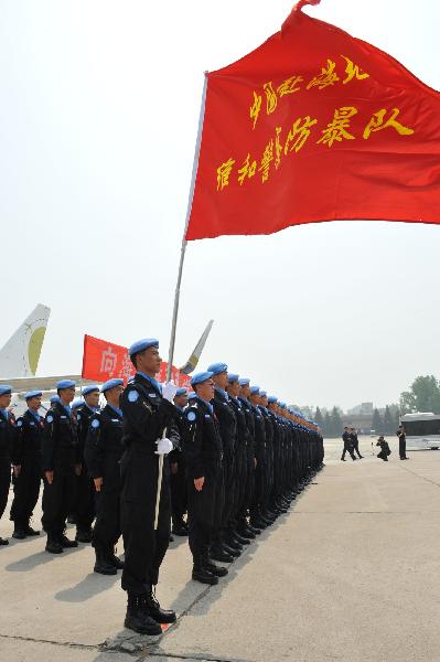 The eighth contingent of Chinese riot police, which is made up of 126 police officers, arrived in Beijing on Tuesday after they successfully carried out their assignments as UN peacekeepers in Haiti.
