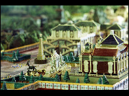 Visitors look at a mini replica of the Old Summer Palace at the Shanghai World Expo on May 4, 2010. The panorama replica of the Old Summer Palace was unveiled in the World Trade Center Pavilion at the Shanghai World Expo. Scaled down at a rate of 1:150, it represents the magnificent Old Summer Palace at its peak. [Xinhua]