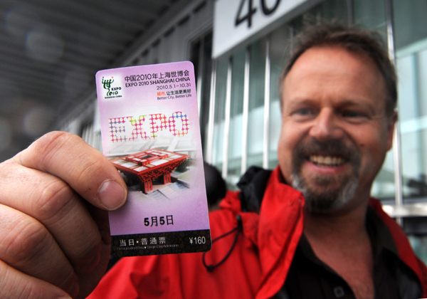 A tourist shows a ticket he just bought outside a ticket office of the World Expo Park in Shanghai, east China, on May 5, 2010. Organizers of the Shanghai World Expo began on Wednesday to sell tickets for ordinary dates to the public.