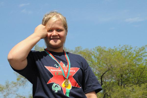 An athlete reacts on the podium during an awarding ceremony at the Special Olympics Chicago 42nd Annual Spring Games in Chicago, the United States, May 5, 2010. The Games took place on May 5-7, 2010. (Xinhua/Jiang Xintong)