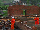 People busy with post storm relief work