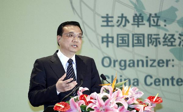 Chinese Vice Premier Li Keqiang delivers a speech on the opening ceremony of International Cooperative Conference on Green Economy and Climate Change in Beijing, capital of China, May 8, 2010. [Ding Lin/Xinhua]