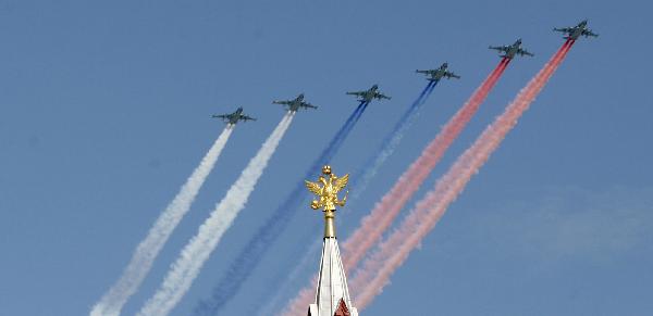 Military aircrafts fly above during a military parade marking the 65th anniversary of the victory over Nazi Germany in the Great Patriotic War, at the Red Square in Moscow May 9, 2010. [Lu Jinbo/Xinhua]