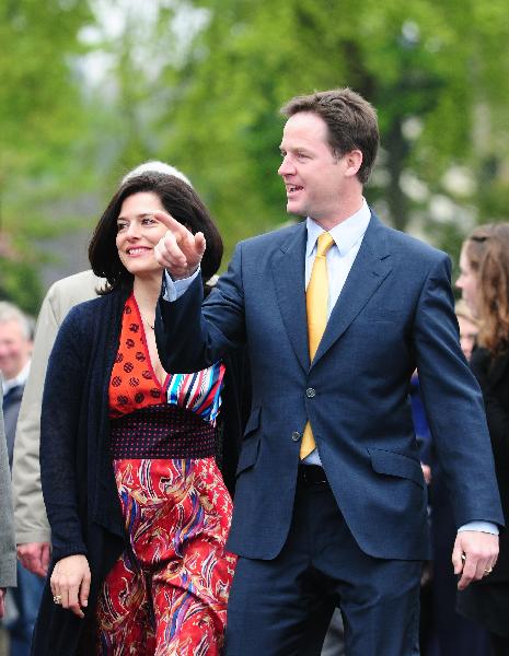File photo taken on May 6, 2010 shows Liberal Democrats leader Nick Clegg (R) and his wife Miriam Gonzalez Durantez walking to a polling station in Sheffield, Britain. The new Downing Street cabinet of David Cameron confirmed Nick Clegg would be the Deputy Prime Minister which has been approved by Queen Elizabeth II. (Xinhua/Zeng Yi)