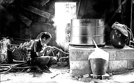 People in Yaogu village, Libo county, using traditional methods to make liquor.