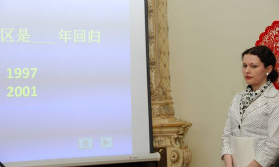 Anna Nidbalska answers questions during the 7th 'Chinese Bridge' Chinese language competition in Riga, capital of Latvia, May 11, 2010. [Xinhua photo]