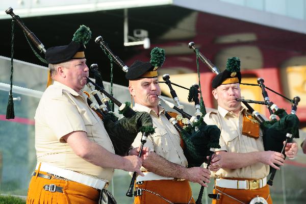 Members of a military band perform bagpipes in front of the Ireland Pavilion in the World Expo park in Shanghai, east China, May 11, 2010. The military band will perform for visitors in Shanghai from May 9 to 12. 