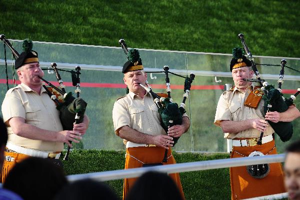 Members of a military band perform bagpipes in front of the Ireland Pavilion in the World Expo park in Shanghai, east China, May 11, 2010. The military band will perform for visitors in Shanghai from May 9 to 12. 