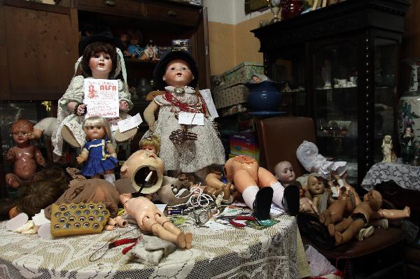 Broken dolls lie in doll repairman Julio Roldan's studio in Buenos Aires, capital of Argentina, May 11, 2010. Julio Rolda, also called doll's surgeon, has led this career for over 40 years. 