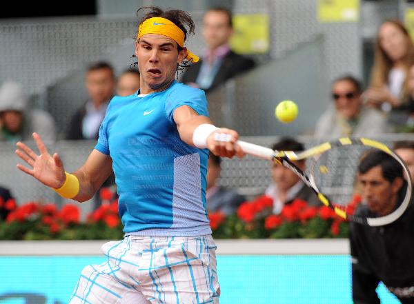 Spain's Rafael Nadal returns the ball during the men's singles second round match against Ukraine's Oleksandr Dolgopolov at the Madrid Open ATP tournament in Madrid, Spain, on May 12, 2010. Nadal won 2-0. (Xinhua/Chen Haitong) 