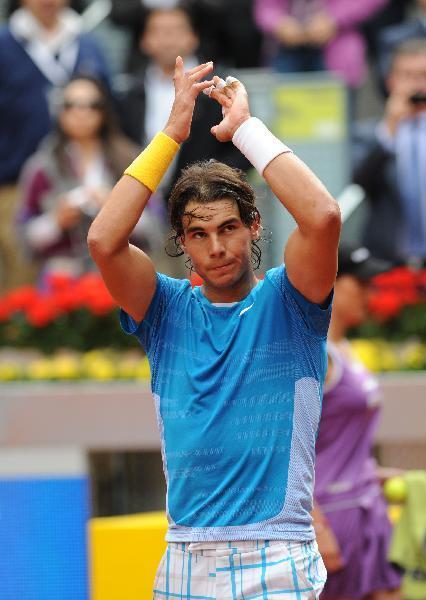 Spain's Rafael Nadal celebrates after the men's singles second round match against Ukraine's Oleksandr Dolgopolov at the Madrid Open ATP tournament in Madrid, Spain, on May 12, 2010. Nadal won 2-0. (Xinhua/Chen Haitong)