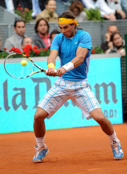 Spain's Rafael Nadal returns the ball during the men's singles second round match against Ukraine's Oleksandr Dolgopolov at the Madrid Open ATP tournament in Madrid, Spain, on May 12, 2010. Nadal won 2-0. (Xinhua/Chen Haitong) 