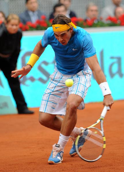 Spain's Rafael Nadal returns the ball during the men's singles second round match against Ukraine's Oleksandr Dolgopolov at the Madrid Open ATP tournament in Madrid, Spain, on May 12, 2010. Nadal won 2-0. (Xinhua/Chen Haitong) 