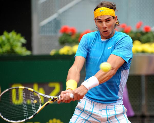 Spain's Rafael Nadal returns the ball during the men's singles second round match against Ukraine's Oleksandr Dolgopolov at the Madrid Open ATP tournament in Madrid, Spain, on May 12, 2010. Nadal won 2-0. (Xinhua/Chen Haitong) 