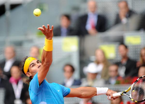 Spain's Rafael Nadal serves during the men's singles second round match against Ukraine's Oleksandr Dolgopolov at the Madrid Open ATP tournament in Madrid, Spain, on May 12, 2010. Nadal won 2-0. (Xinhua/Chen Haitong) 