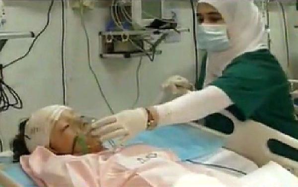 An image grab taken from footage broadcast by Libyan TV shows the Dutch child who survived a plane crash being treated at a hospital in Tripoli. A Libyan airliner arriving from South Africa disintegrated on landing at Tripoli airport, killing 103 people but leaving the child as the sole miracle survivor, officials said. (Xinhua/AFP Photo)