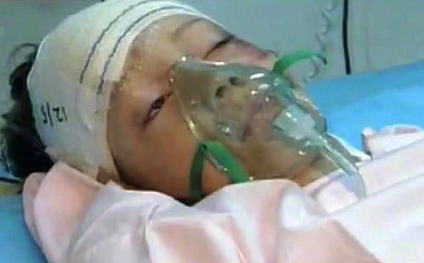 An image grab taken from footage broadcast by Libyan TV shows the Dutch child who survived a plane crash being treated at a hospital in Tripoli. A Libyan airliner arriving from South Africa disintegrated on landing at Tripoli airport, killing 103 people but leaving the child as the sole miracle survivor, officials said. (Xinhua/AFP Photo)