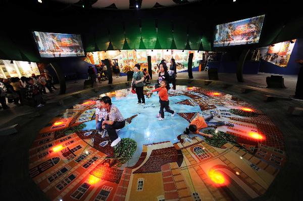 Tourists visit the Belarus Pavilion at the World Expo Park in Shanghai, east China, May 11, 2010. 