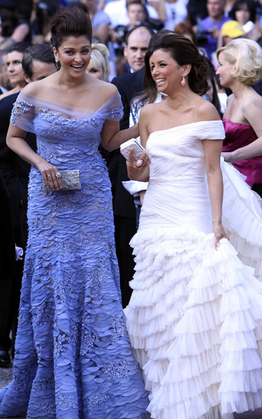 US model and actress Eva Longoria(R) and Indian actress Aishwarya Rai arrive for the opening ceremony and screening of 'Robin Hood' presented out of competition at the 63rd Cannes Film Festival, May 12, 2010.