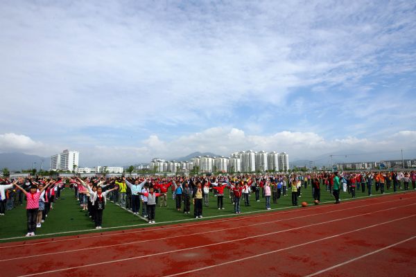 Students do exercises during a break in You'ai School of Dujiangyan, Sichuan Province, on May 10, 2010.