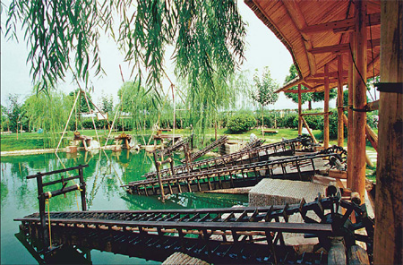  Waterwheels are especially popular among visitors, which help them to get close to nature. provided to China Daily