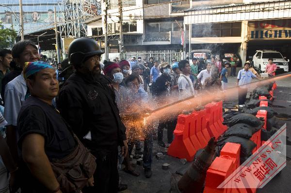 Thai anti-government 'red shirt' protesters shoot fireworks towards army soldiers in Bangkok May 14, 2010. 