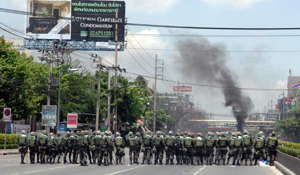 Thai soldiers take position in street of Bangkok, capital of Thailand during a clash with 'Red Shirt' protesters on May 14, 2010. The intense political situation has continued in Bangkok as troops have been deployed nearby the main anti-government rally site Rathchaprasong Intersection in central Bangkok. 