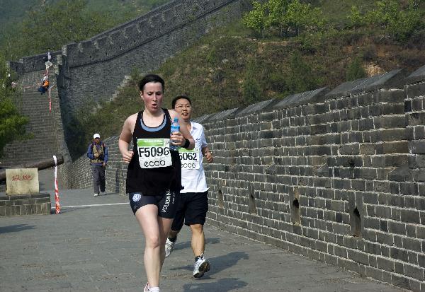 Players take part in a marathon starting on the Zhengguan Square at Huangyaguan Greatwall in Jixian County, Tianjin Municipality, China, May 15, 2010. 