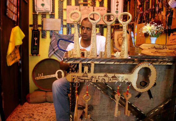 Palestinian sculpture artist Nasser Flefel, 39, carves wooden keys and decorates them with the names of villages which were occupied during the war with Israel in 1948 in his wood-carving shop in Gaza city, May 16, 2010.