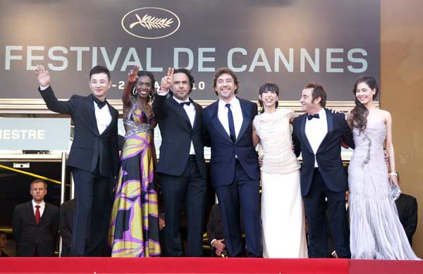 Director Alejandro Gonzalez Inarritu (3rd L) poses with cast members (L-R) Luo Jin, Diaryatou Daff, Javier Bardem, Maricel Alvarez, Eduard Fernandez and Cheng Tai Shen as they arrive on the red carpet for the screening of his film 'Biutiful' in competition at the 63rd Cannes Film Festival May 17, 2010. Nineteen films compete for the prestigious Palme d'Or which will be awarded on May 23.