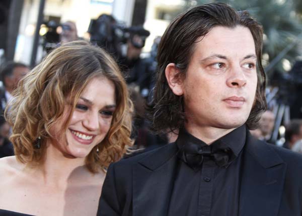 Actress Emilie Dequenne (L) arrives with singer Benjamin Biolay on the red carpet for the screening of the film 'Biutiful' by director Alejandro Gonzalez Inarritu, in competition at the 63rd Cannes Film Festival May 17, 2010. Nineteen films compete for the prestigious Palme d'Or which will be awarded on May 23. 