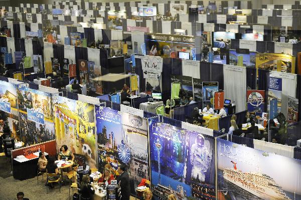People attend the 2010 International POW WOW at the Orange County Convention Center in Orlando, Florida, the United States, May 17, 2010. [Xinhua/Zhang Jun]