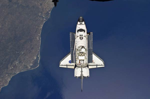 The Space Shuttle Atlantis is backdropped against the Earth prior to docking with the International Space Station in this handout photo provided by NASA and taken May 16, 2010. 