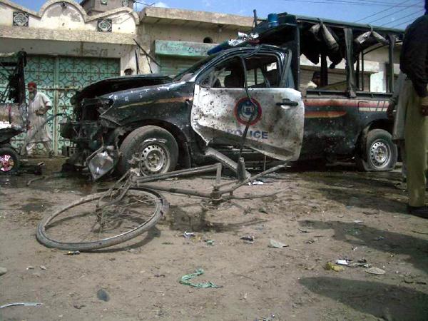 Photo taken on May 18, 2010 shows a damaged police vehicle in the planted bomb blast in northwest Pakistan's Dera Ismail Khan. At least 12 people were killed and 15 injured in the bomb attack targeting a police vehicle on Tuesday. 