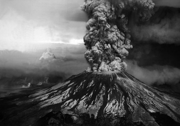 Ash billows from the crater where the summit of Mount St. Helens had been only hours earlier during a huge eruption on May 18th, 1980. 