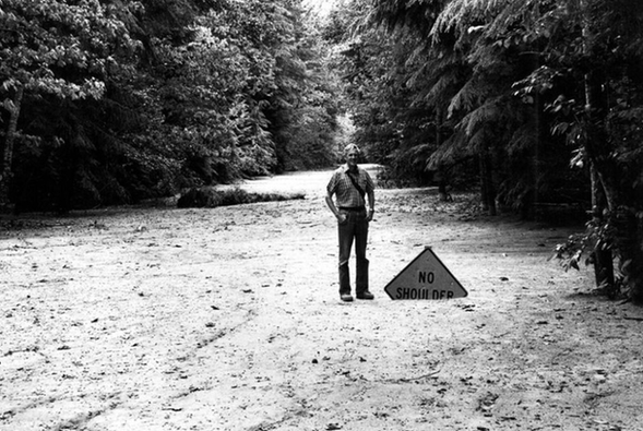 A mudflow deposit covers Washington State Highway 504 near the town of Toutle, northwest of Mount St. Helens, to a depth of 2m.